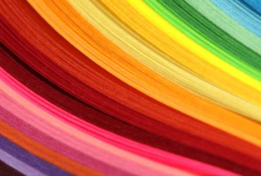 Horizontal Abstract vibrant color wave rainbow strip paper background.